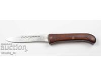 Antique knife with a wooden handle