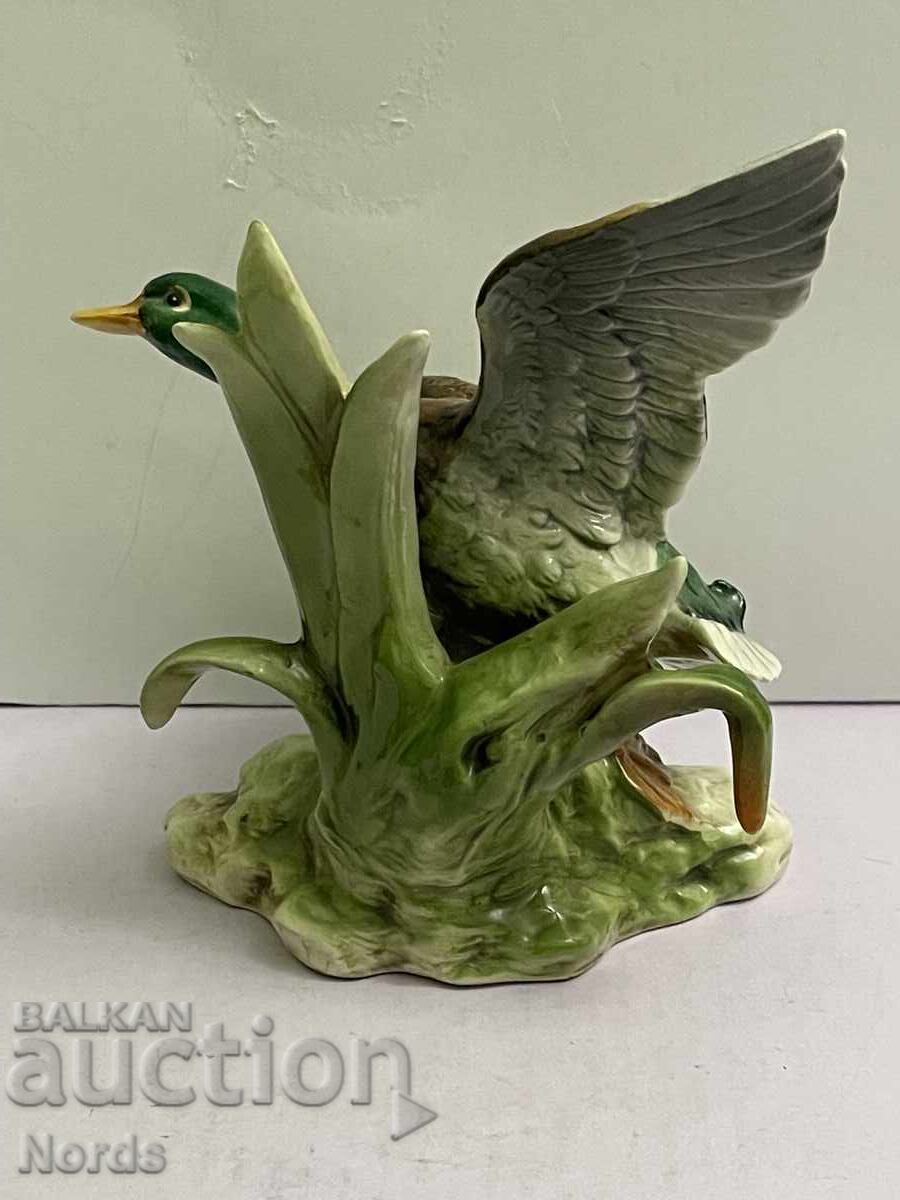 Auction  Porcelain figurine with markings