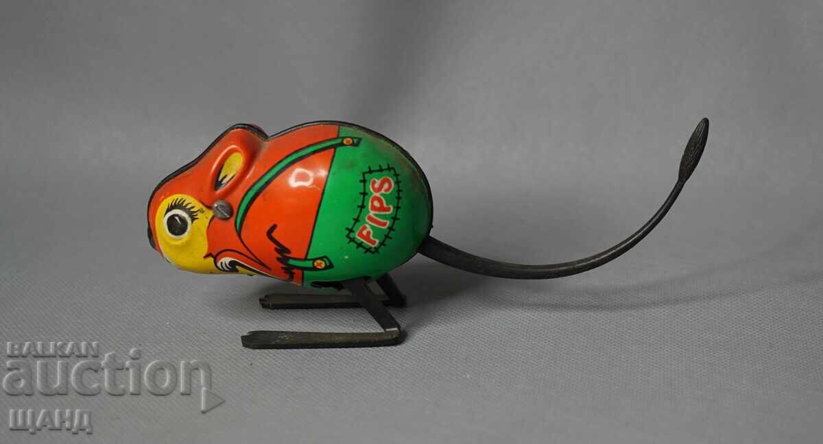 Old metal mechanical toy figure mouse