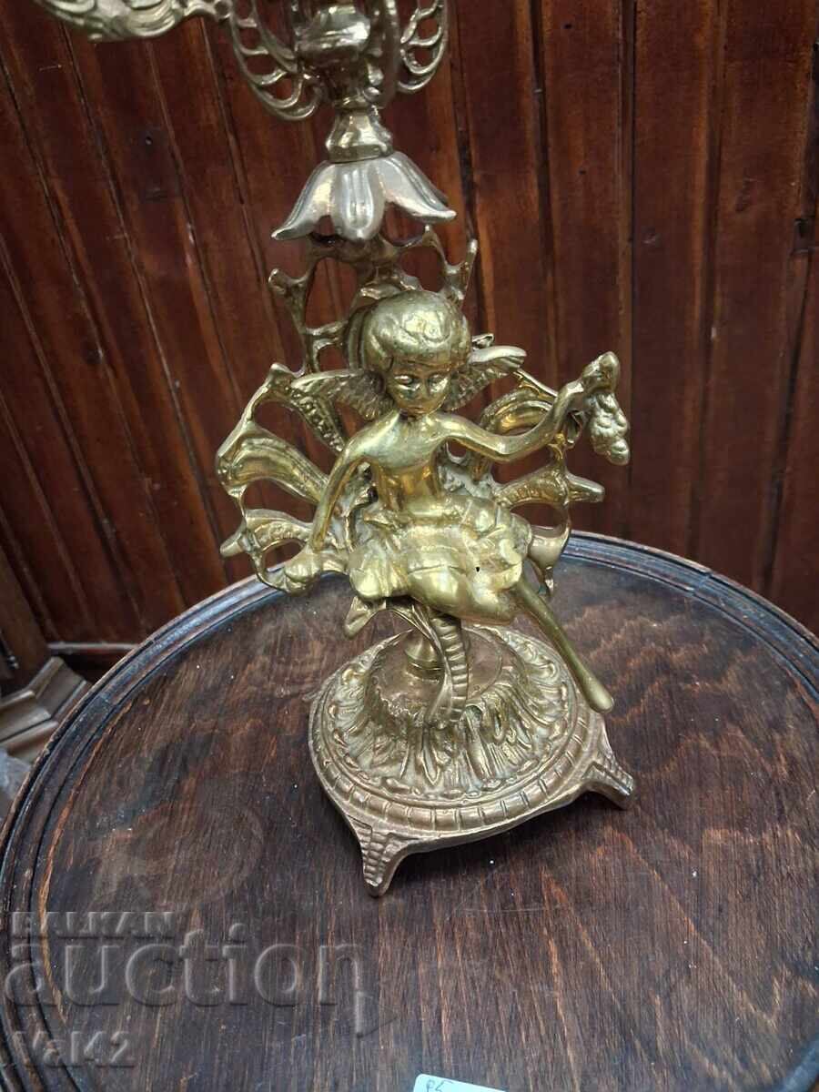 Auction  Bronze candlestick "Five" with figural decoration