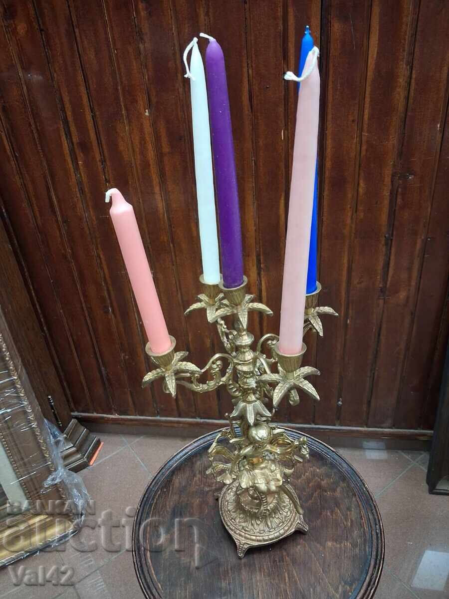 Bronze candlestick "Five" with figural decoration