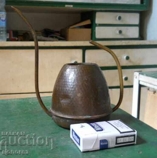 Antique copper watering can for watering flowers Antique copper watering can for watering flowers