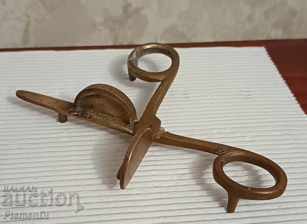 Auction Brass candle snuffer Auction Brass candle snuffer