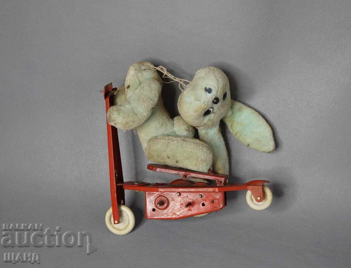 Old mechanical metal toy scooter model with rabbit with price 12.35 BGN | € 6.31