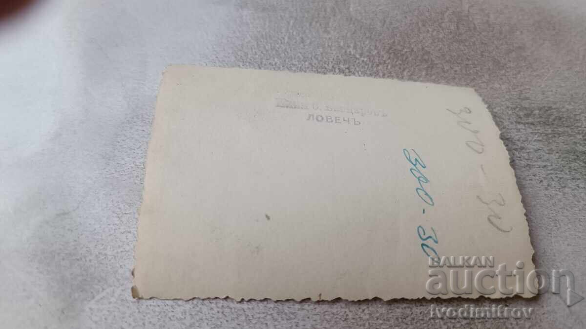 Photo of Lovech. Three men on the sidewalk with price 6.85 BGN | € 3.50