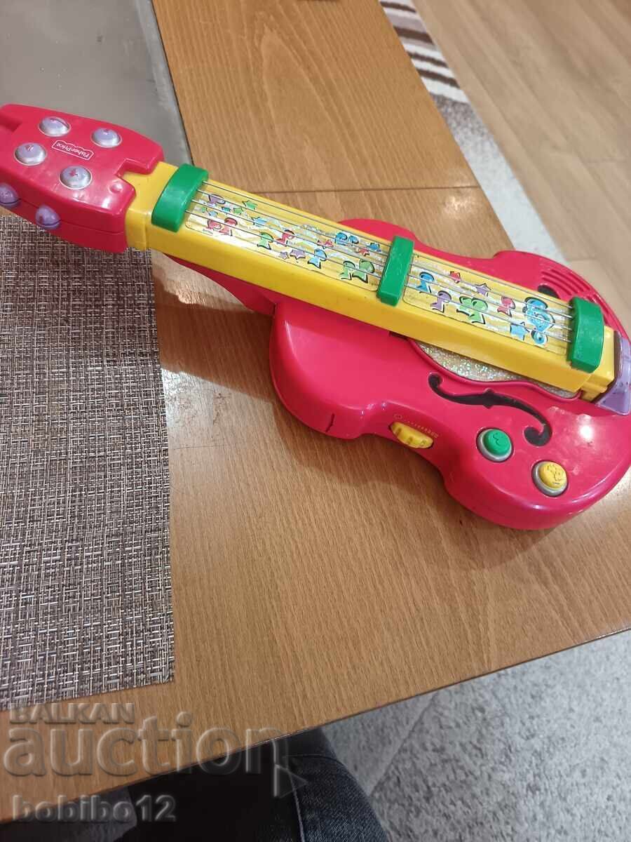 Fisher Price 2 în 1 Chitară/Vioară Bach 'n Rock cu preț € 10.00 | 19.56 BGN Fisher Price 2 în 1 Chitară/Vioară Bach 'n Rock cu preț € 10.00 | 19.56 BGN