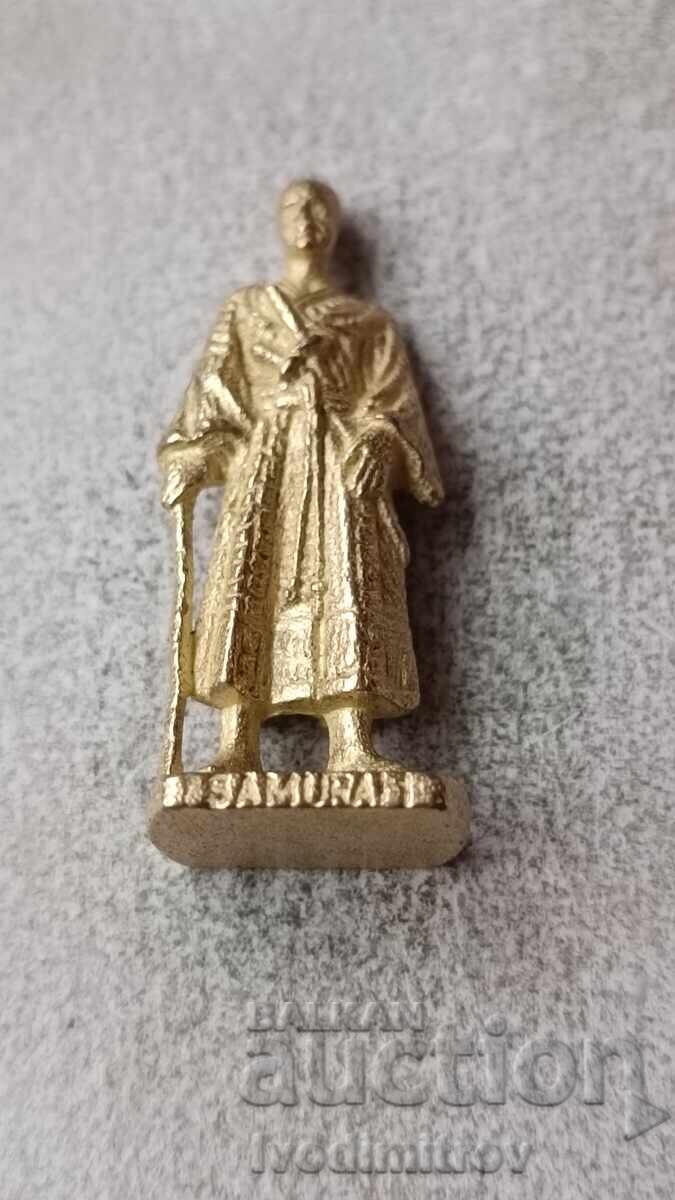 Figurină metalică din ou de ciocolată Samurai 1 Figurină metalică din ou de ciocolată Samurai 1