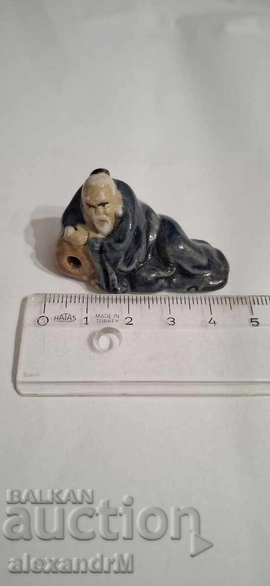 Chinese ceramic figurine, "mudman" type Chinese ceramic figurine, "mudman" type