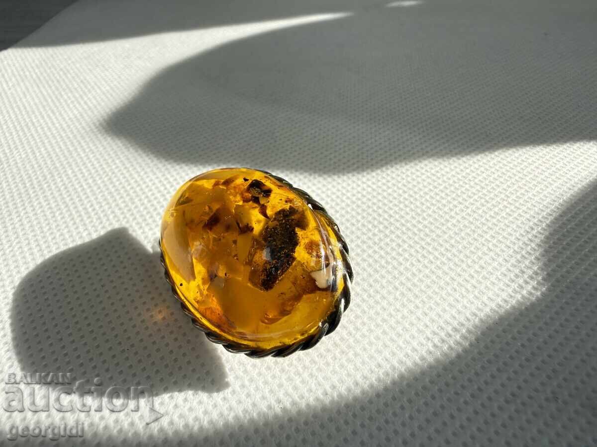 Auction Old amber brooch. No. 7740 Auction Old amber brooch. No. 7740