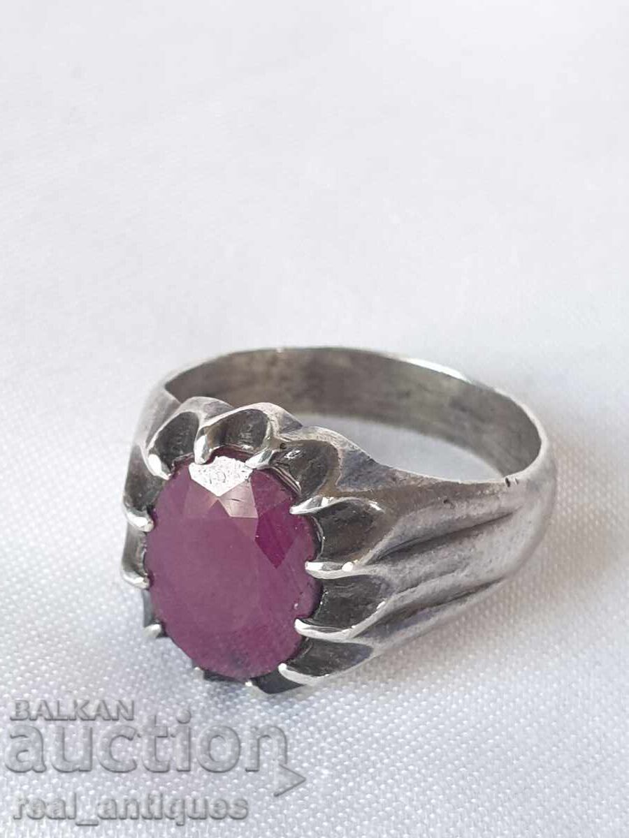 Silver ring with a ruby