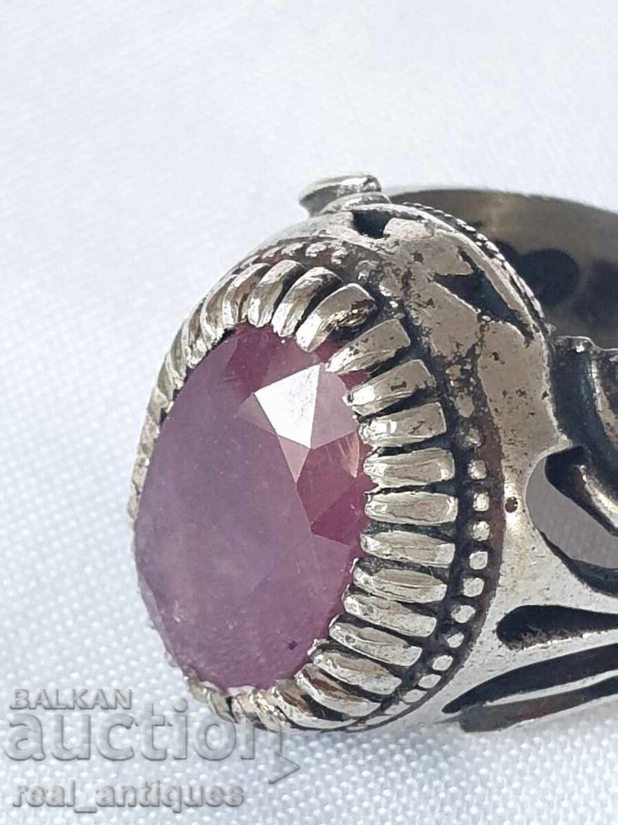 Silver ring with a ruby