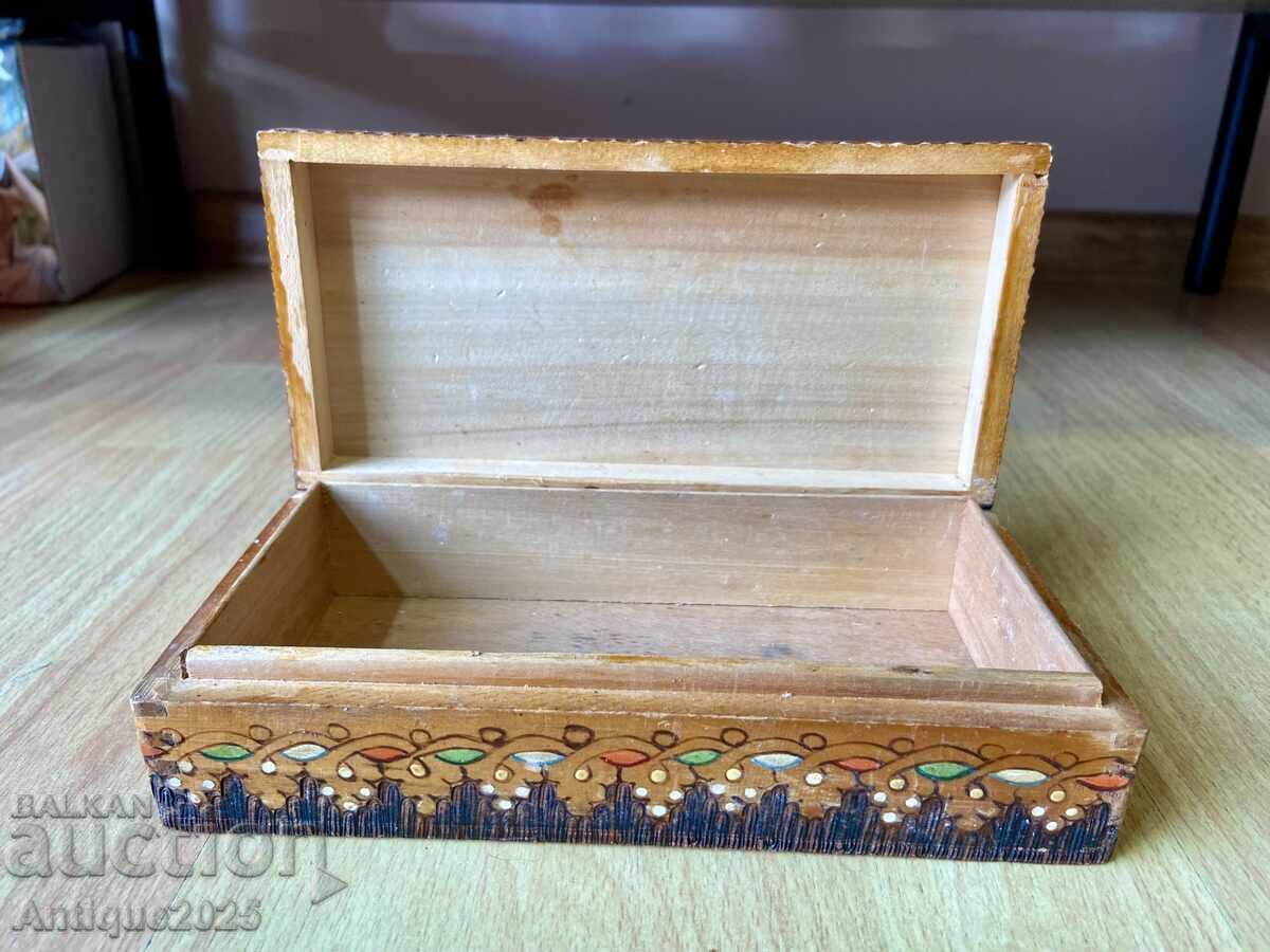 Delivery of Antique wooden box with vibrant folk ornament