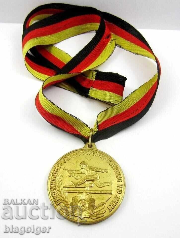 ГДР-НАРОДНА АРМИЯ-МЕДАЛ-ВОЕНЕН СПОРТ-НАГРАДЕН МЕДАЛ-I МЯСТО с цена € 15.33 | 29.98 лв.