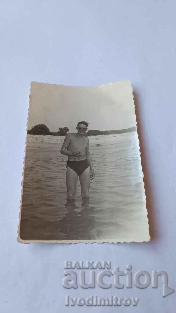 Photo of a Man with a Cigarette in the Sea Photo of a Man with a Cigarette in the Sea