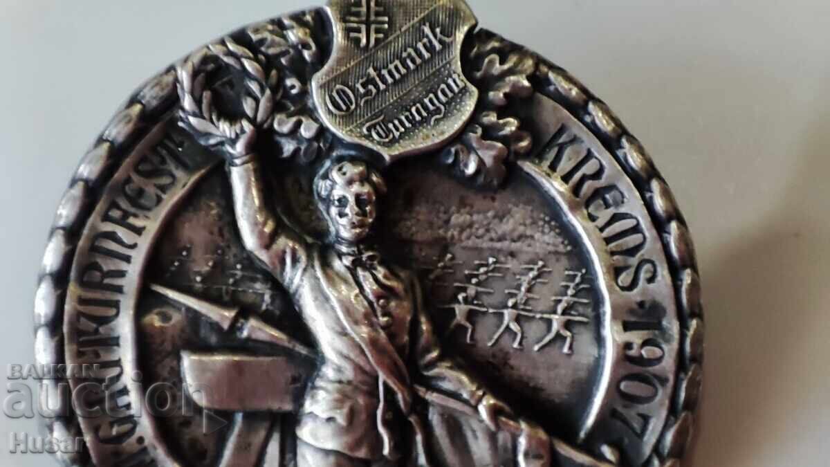 Licitație Semn pectoral Austria 1907 sportiv, adunare de eroi argint ? Licitație Semn pectoral Austria 1907 sportiv, adunare de eroi argint ?