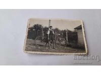Photo of a Boy with a Retro Bicycle
