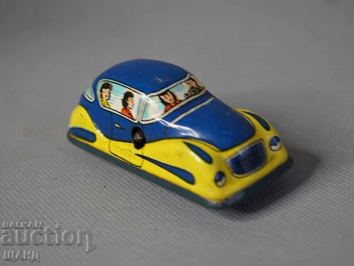 Auction Old metal mechanical toy car model for a racetrack Auction Old metal mechanical toy car model for a racetrack