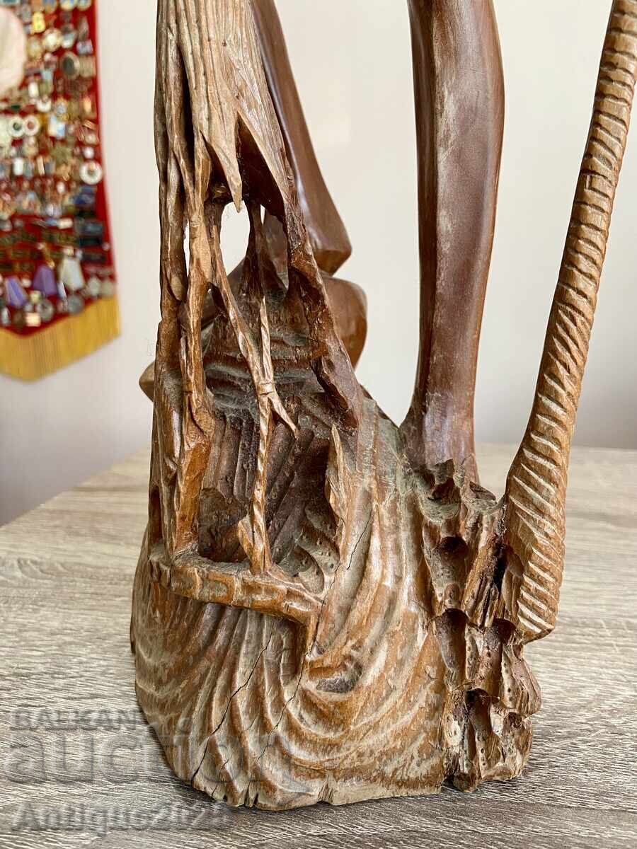 Delivery of Vintage carved teak wood sculpture — fisherman with net