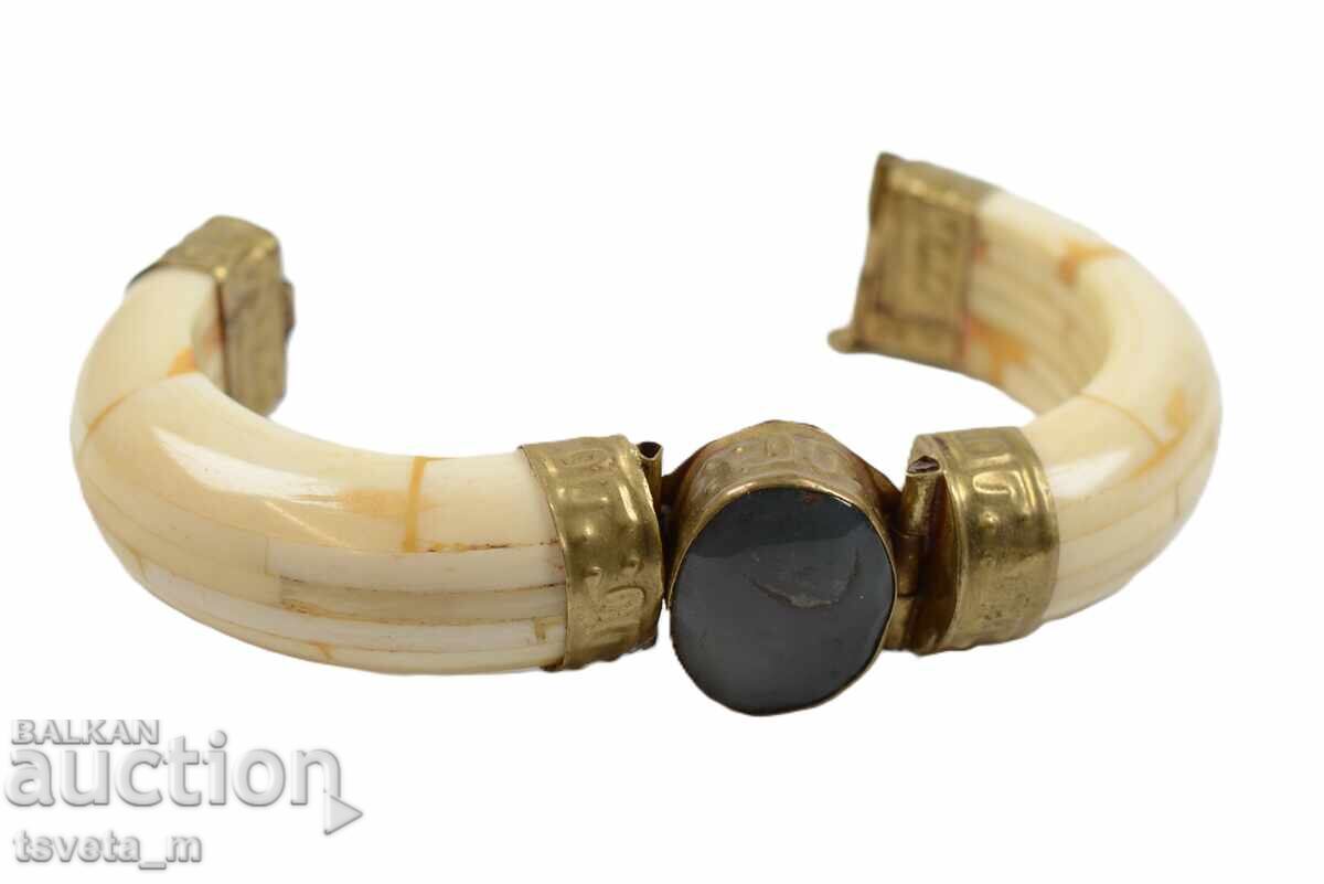 Delivery of Antique bone bracelet with brass elements and a stone Delivery of Antique bone bracelet with brass elements and a stone