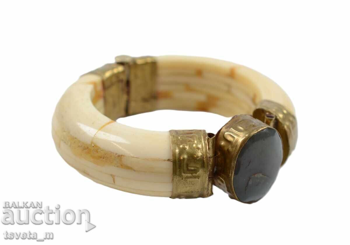 Antique bone bracelet with brass elements and a stone Antique bone bracelet with brass elements and a stone