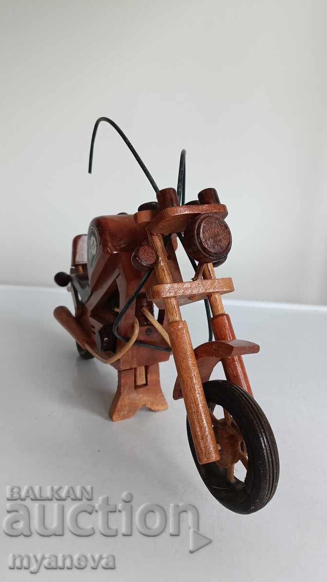 Delivery of Harley-Davidson, wooden model of a retro motorcycle Delivery of Harley-Davidson, wooden model of a retro motorcycle
