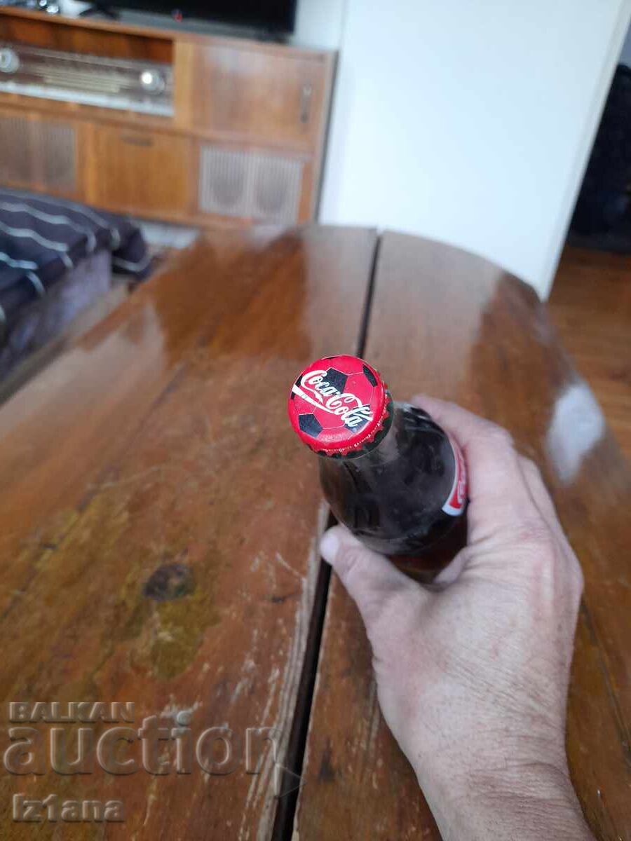 Παράδοση Ένα παλιό μπουκάλι Coca Cola, Coca Cola