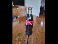 O sticlă veche de Coca Cola, Coca Cola