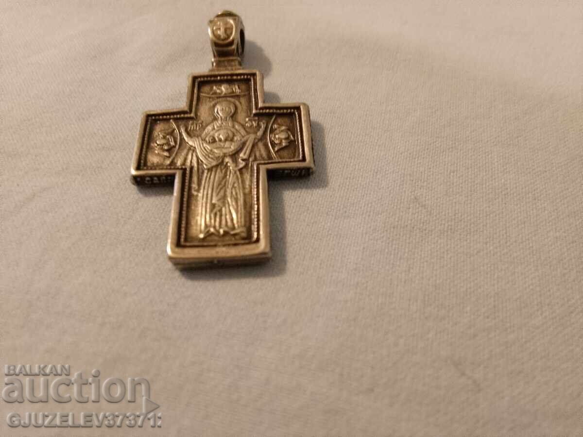 Silver cross with oxidation - light and protection