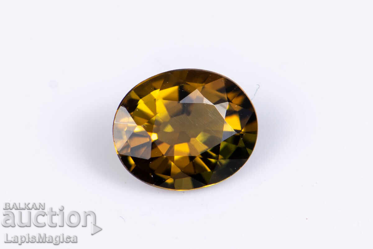 Оранжев турмалин дравит 0.46ct флуоресцентен, овална шлифовк