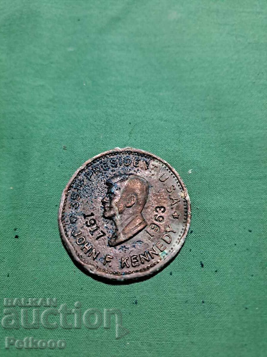 Монета с лика на Джон Кенеди
