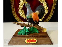 Порцеланова фигура Глухар,поставка за пура,лого на бира Hass