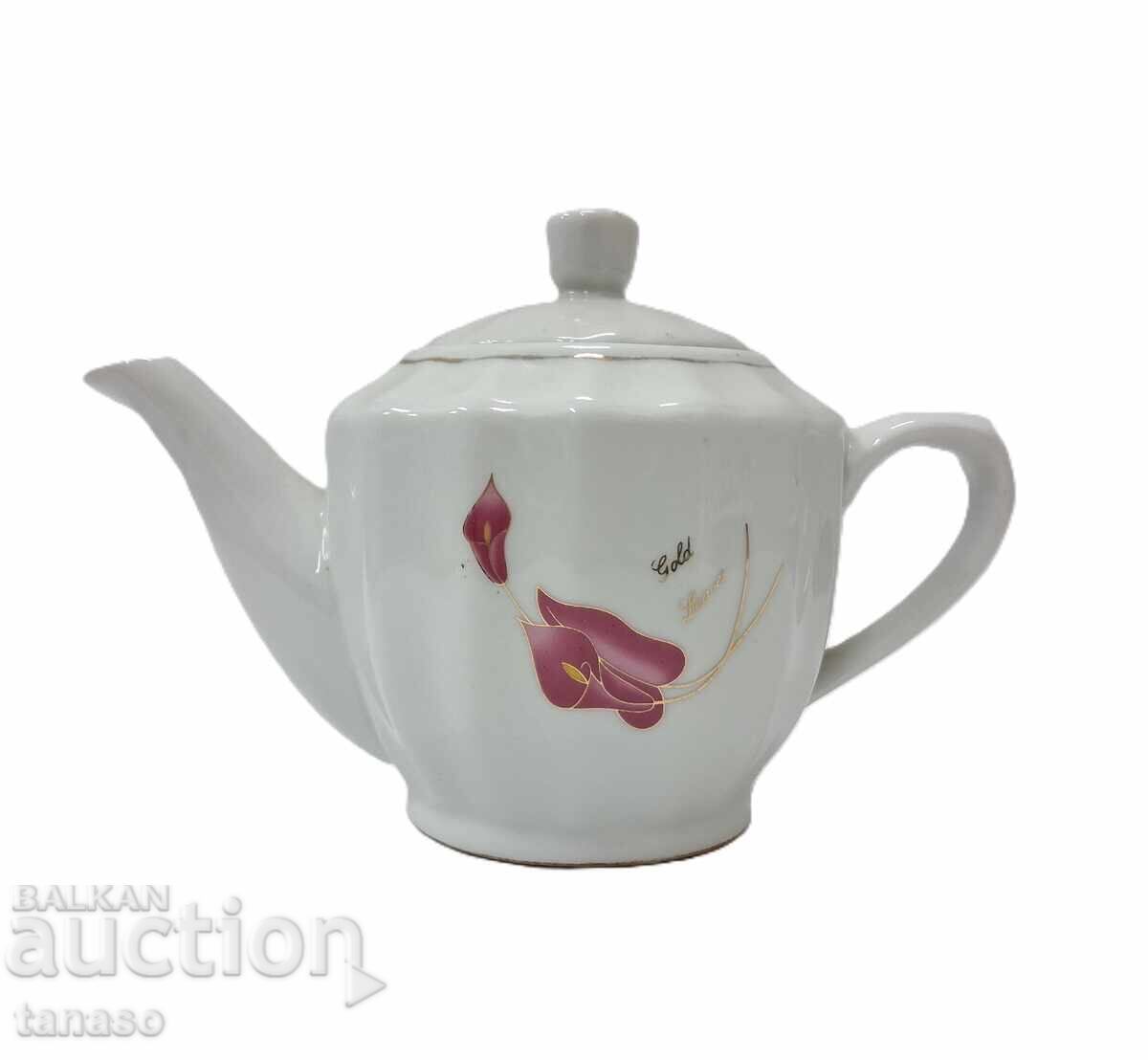 Small porcelain Chinese teapot for tea, coffee, milk