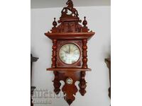 Antique Dutch wall clock with a horse on top