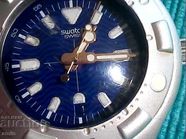 Beautiful Swatch Irony, works perfectly, with a new battery