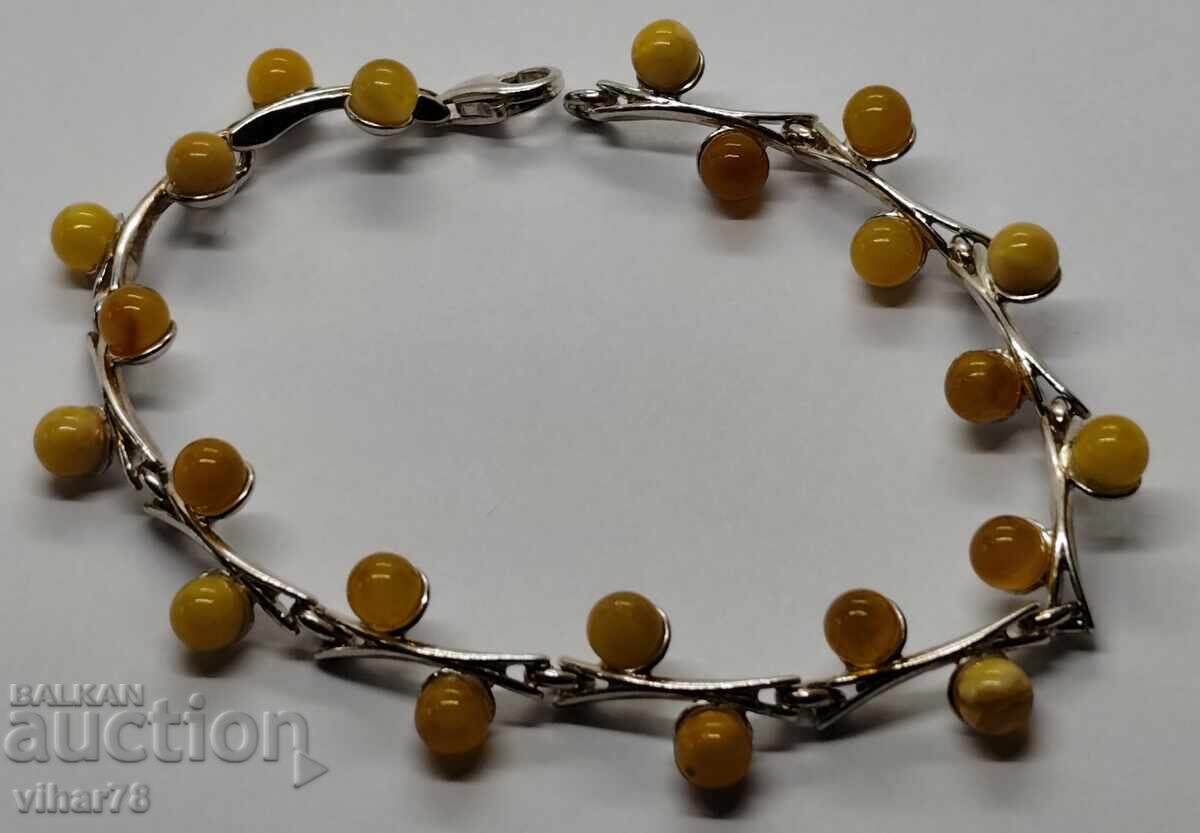 Delicate silver bracelet with 22 pieces of yellow amber with price € 149.99 | 293.36 BGN