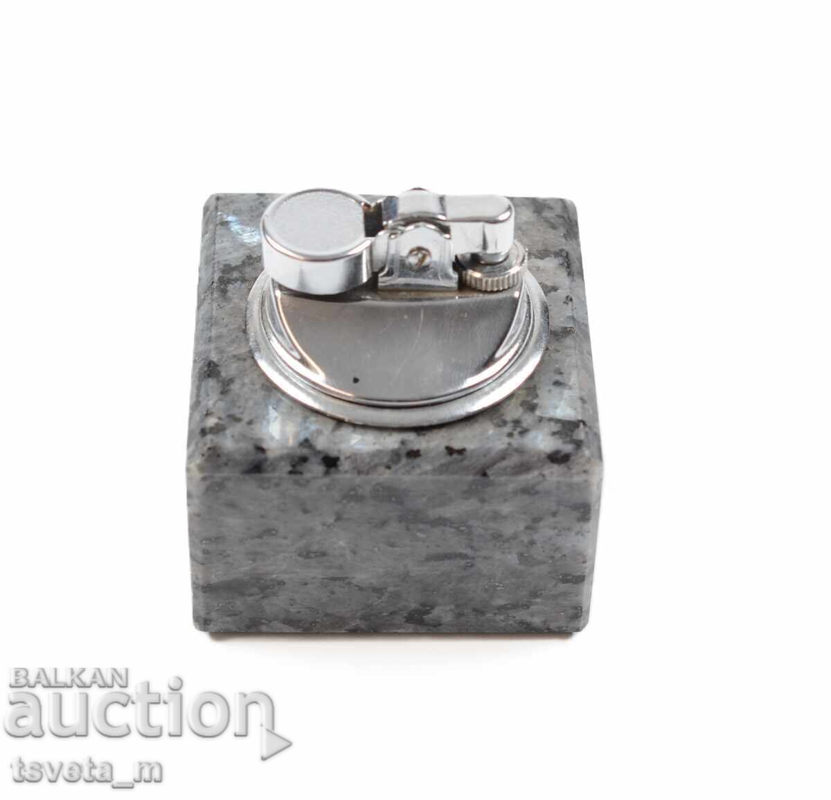 Auction Tabletop gas lighter with a marble base Auction Tabletop gas lighter with a marble base