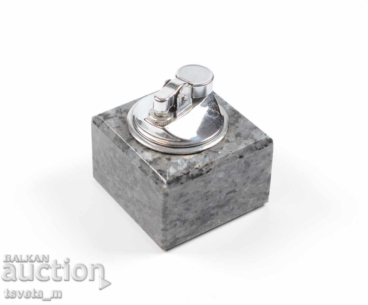 Tabletop gas lighter with a marble base Tabletop gas lighter with a marble base