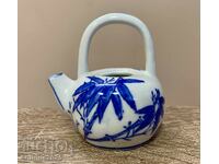 Japanese porcelain teapot with bamboo decor, Japan