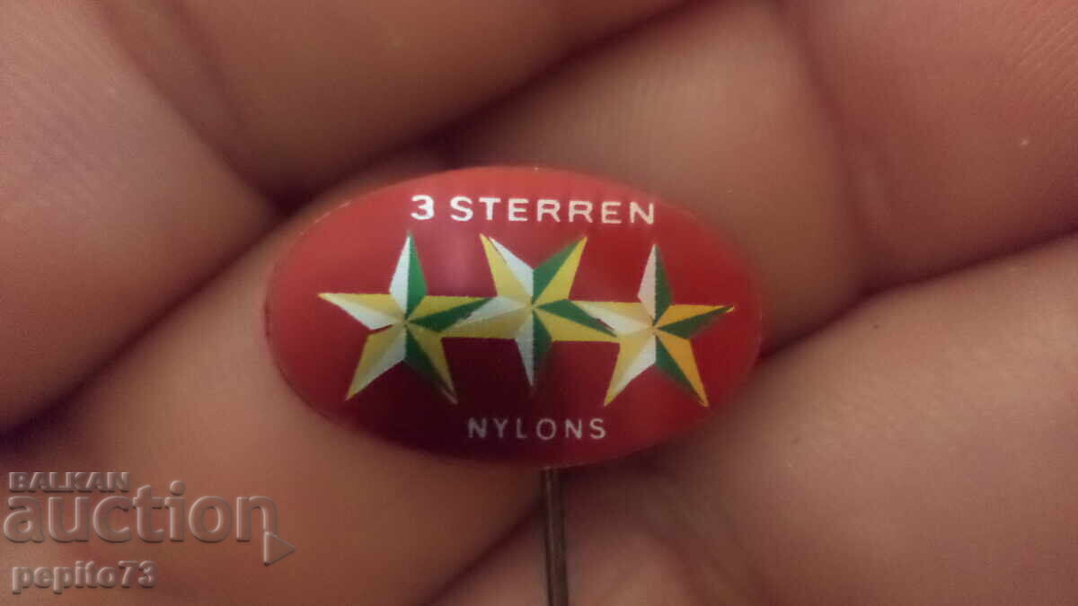 Insigna publicitară, 3 Sterren Nylons, marcă de articole din poliester