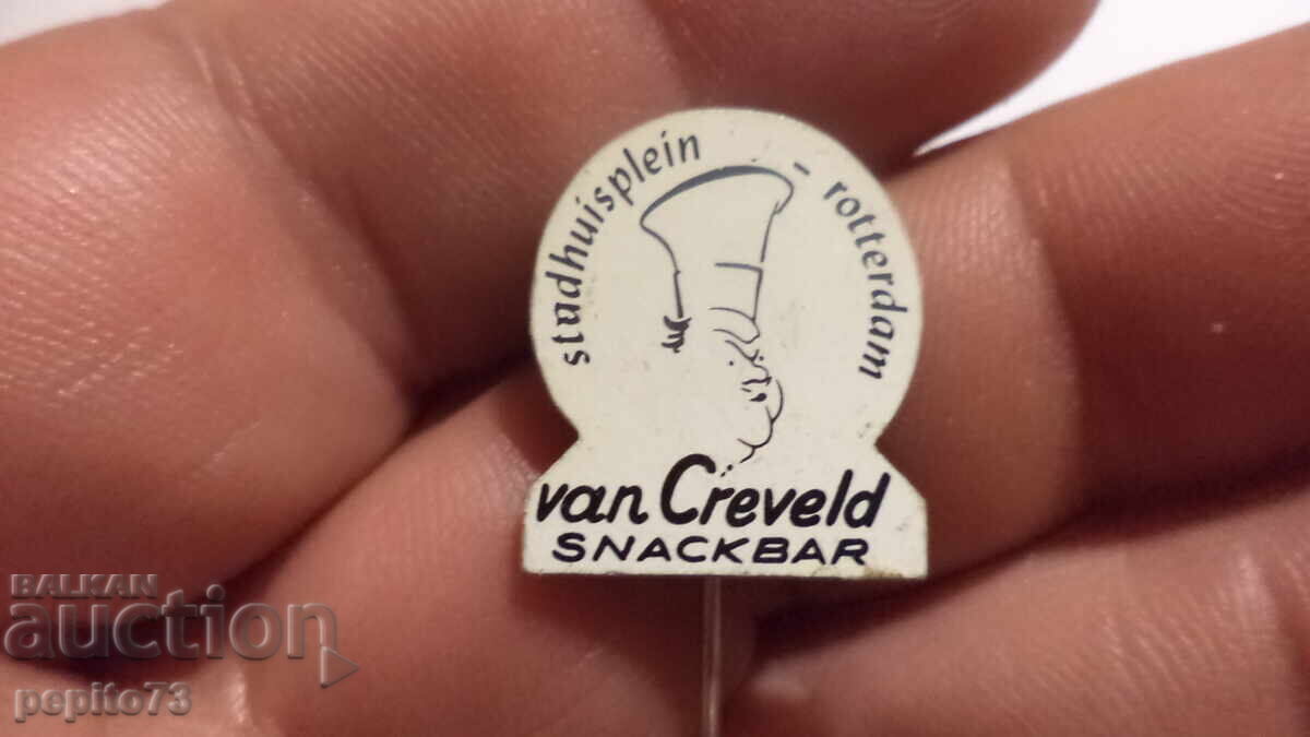 Insigna publicitară Van Creveld Insigna publicitară Van Creveld