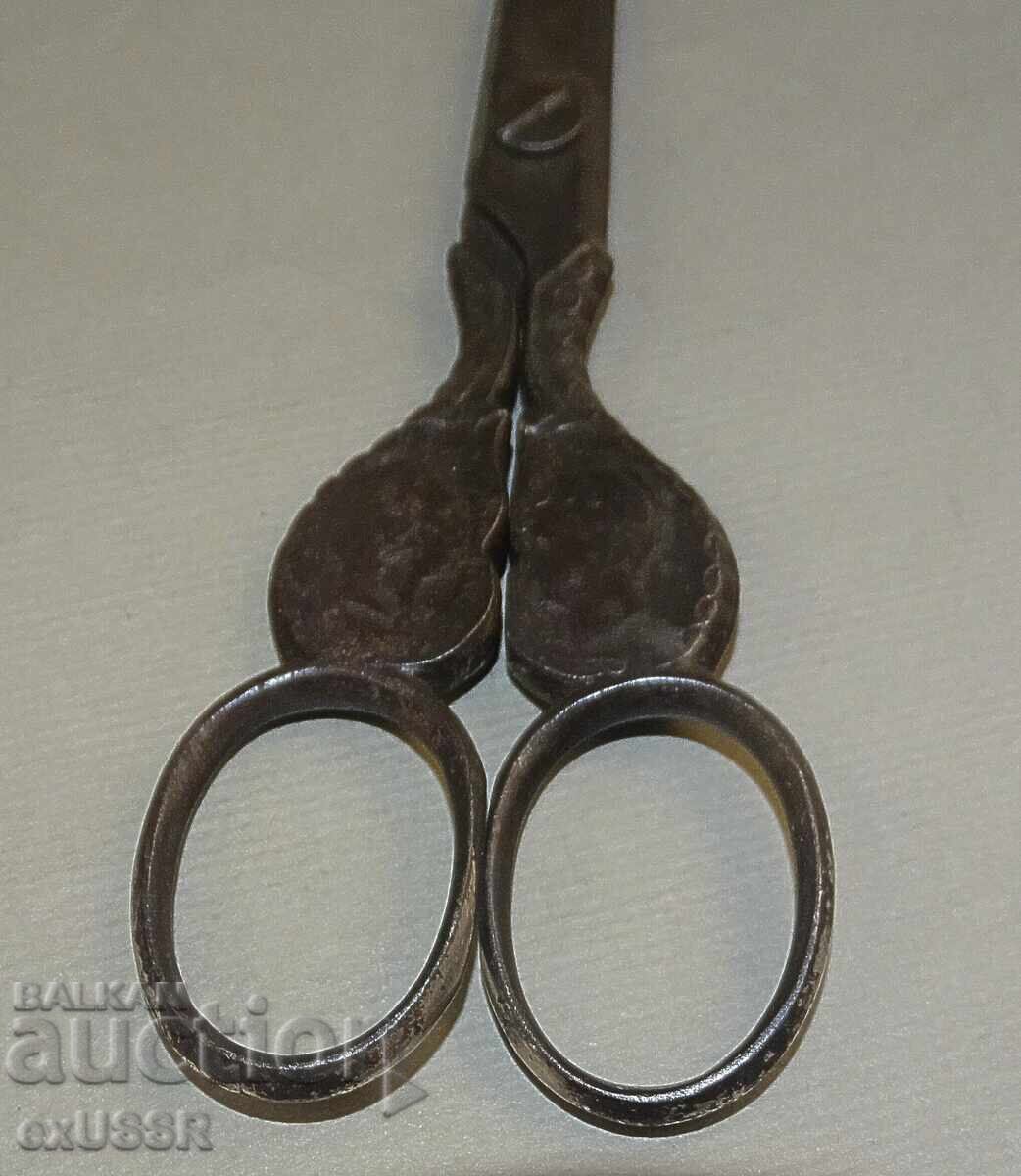 Delivery of Old tailor's scissors with ornaments for needlework