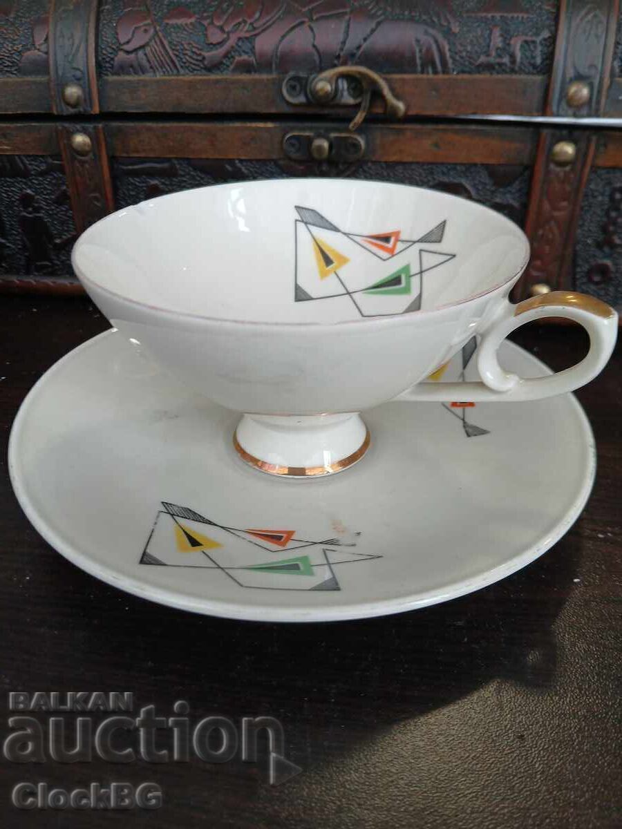 Vintage porcelain cup with saucer