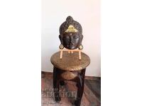 Buddha with closed eyes, symbolizing meditation and inner peace