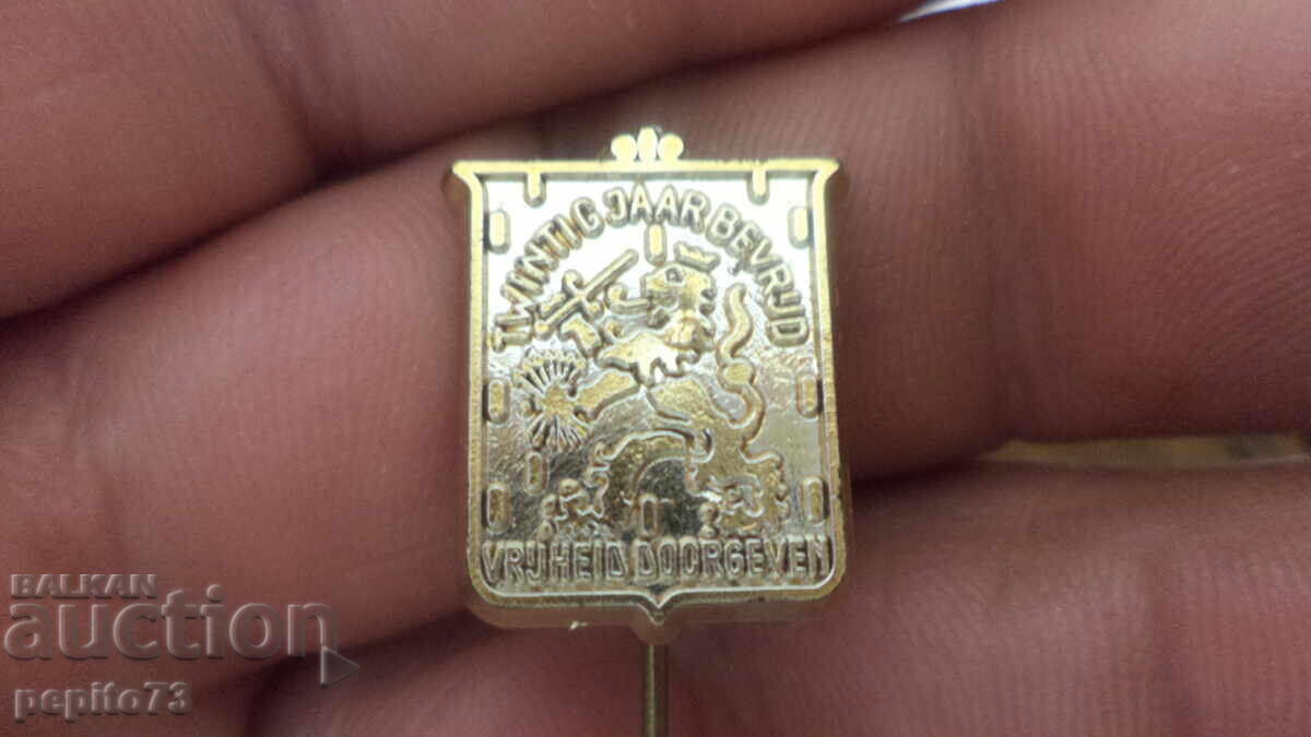 Znachka reklamna, Leu olandez cu preț € 1.00 | 1.96 BGN