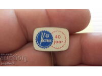 Advertising badge, Victrix, Siren brand