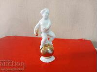 Porcelain figurine - Angel on a globe - Herold AG Tetta