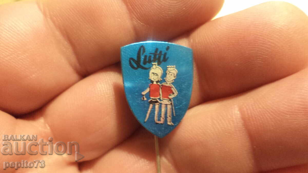 Emblemă publicitară, Lutti, marcă de dulciuri cu preț € 1.00 | 1.96 BGN