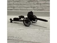Decorative metal model of an artillery gun