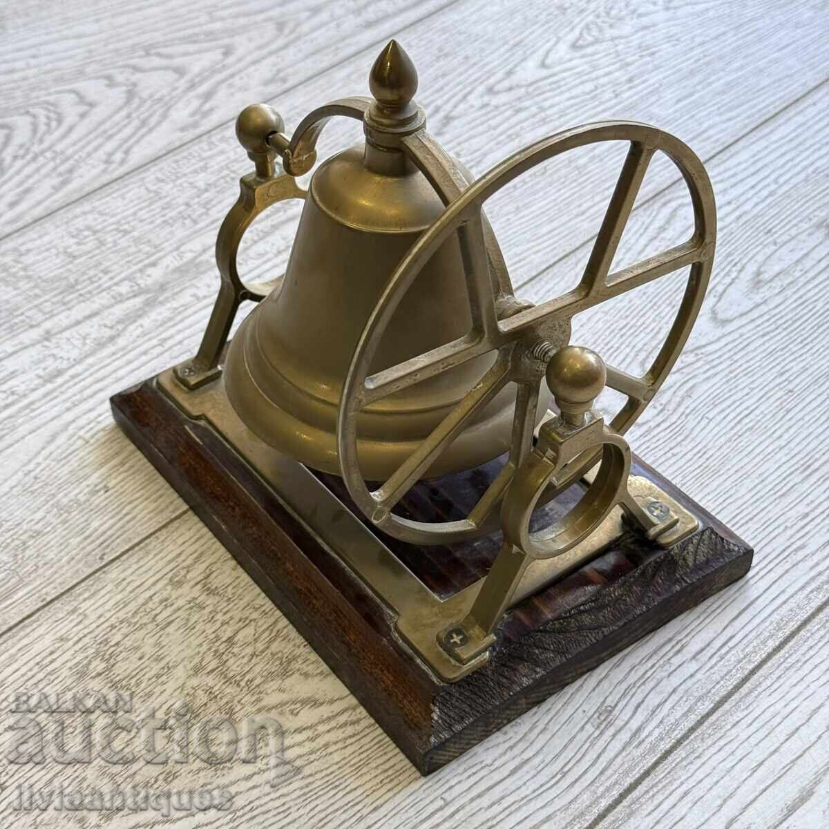 Brass bell on a solid wooden base