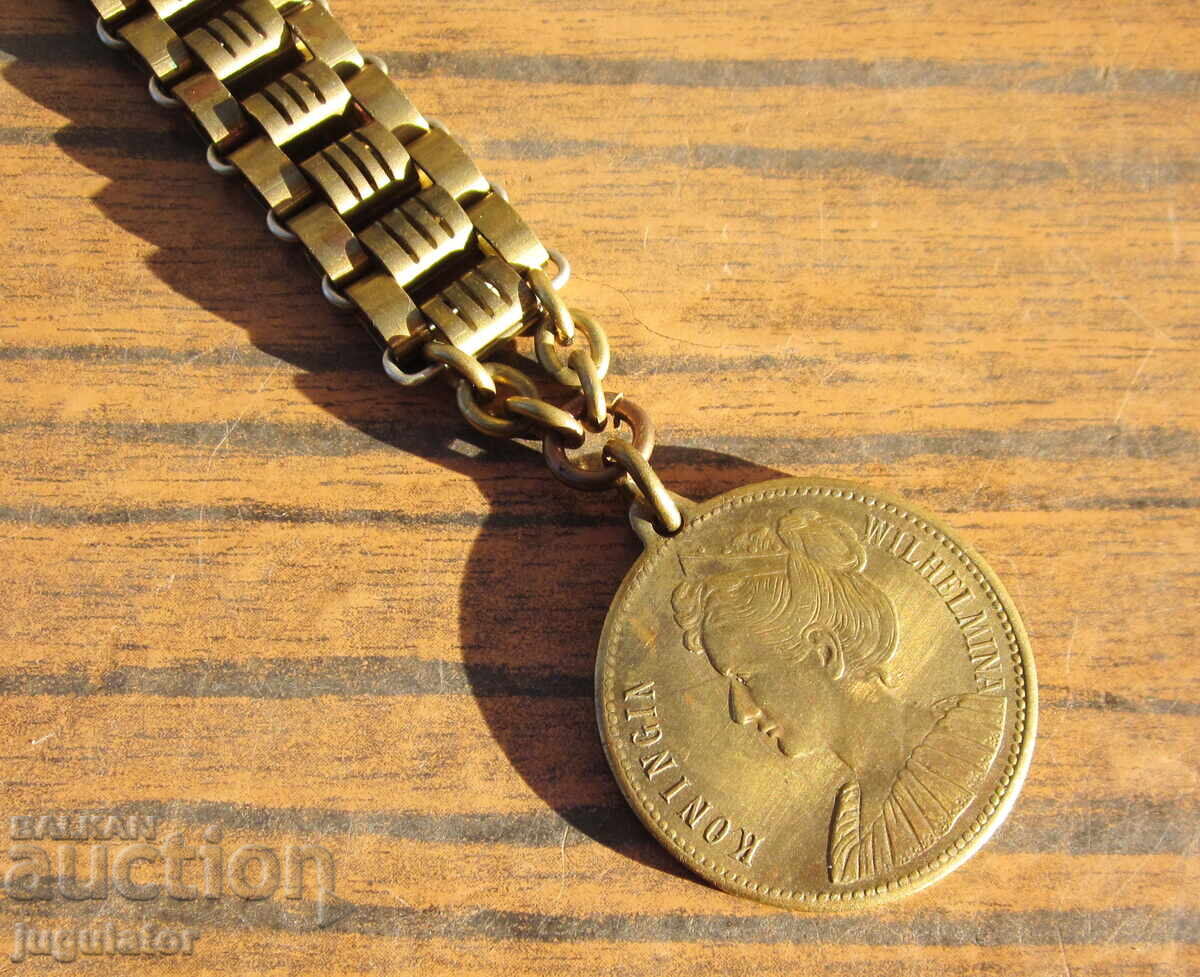 Auction  Antique gold-plated chain with fob medal for pocket watch